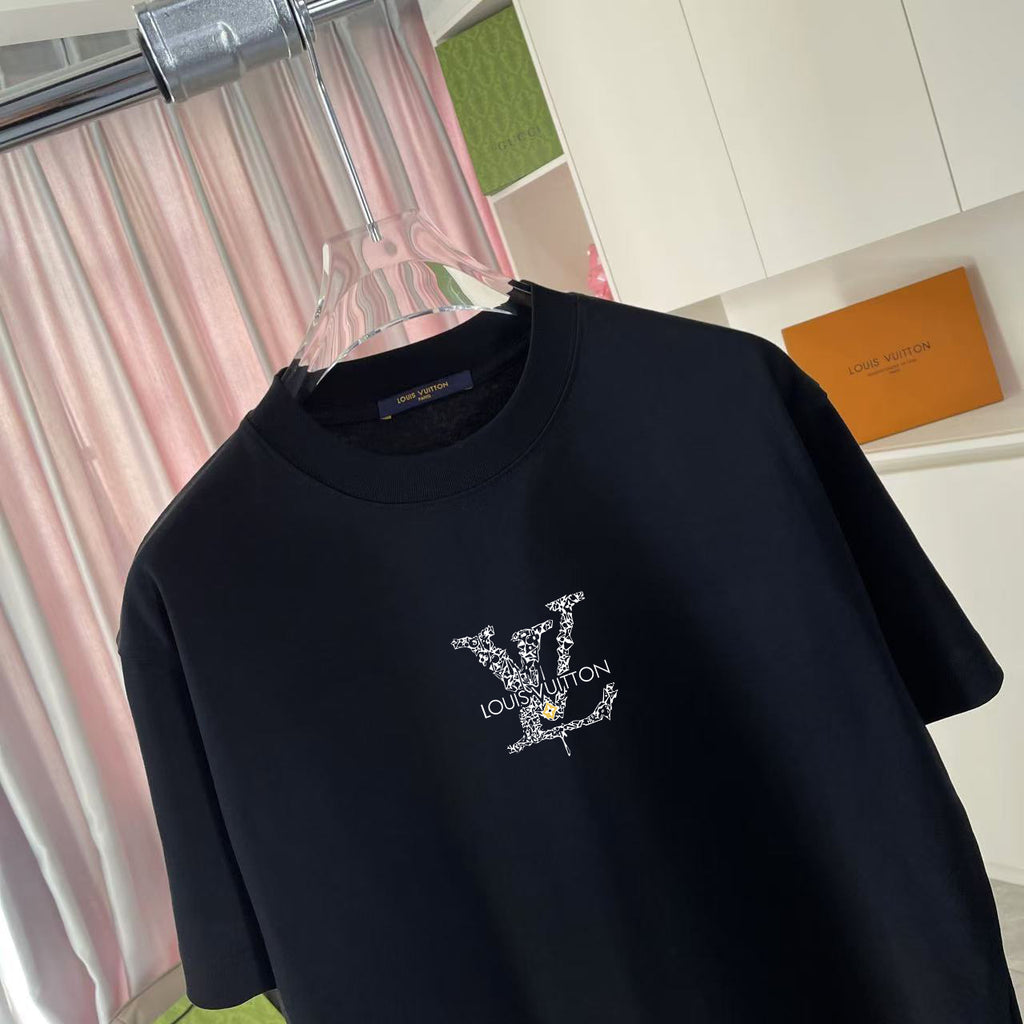 Black T-shirt close-up of embellished Louis Vuitton logo graphic