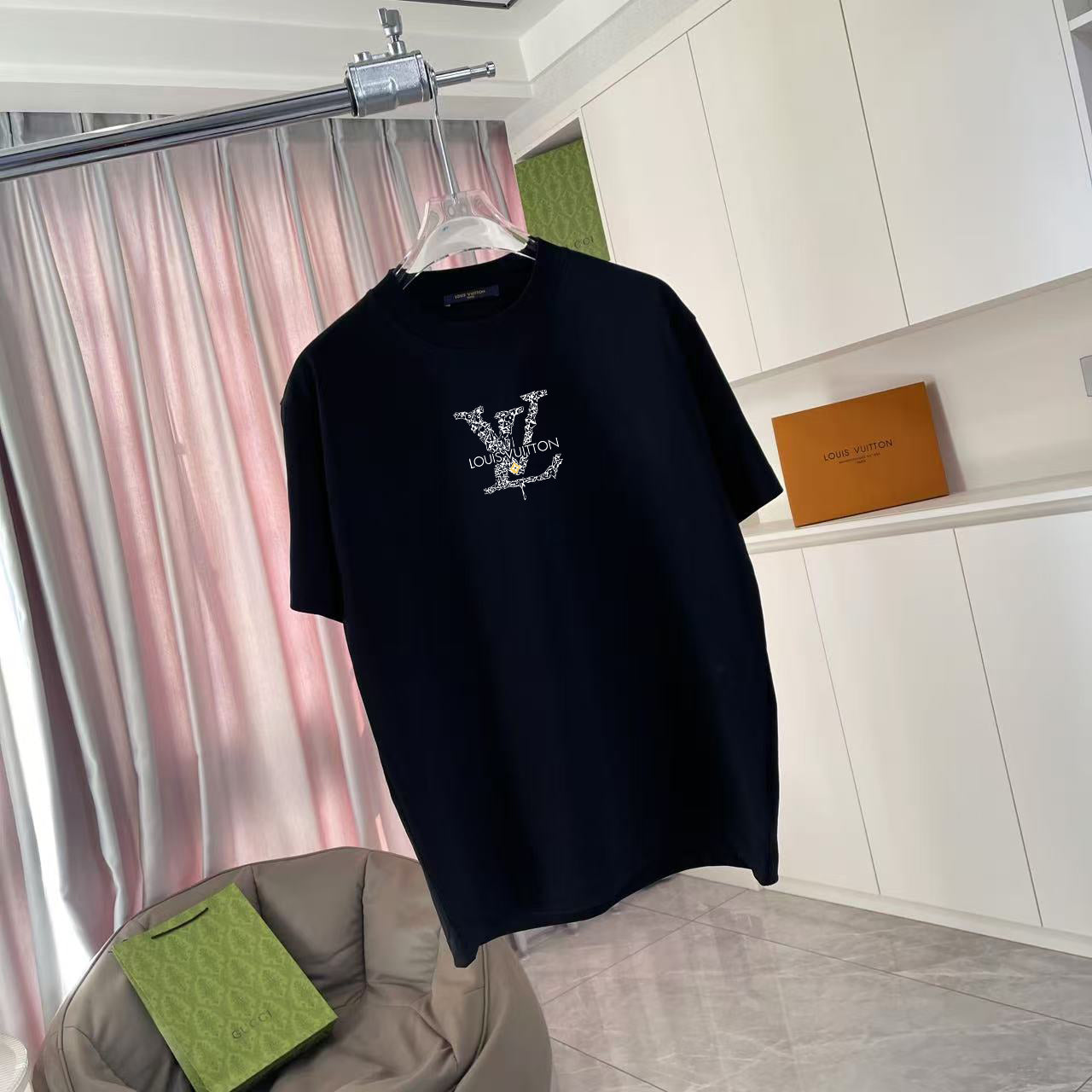 Black T-shirt with logo graphic on the front, short sleeves