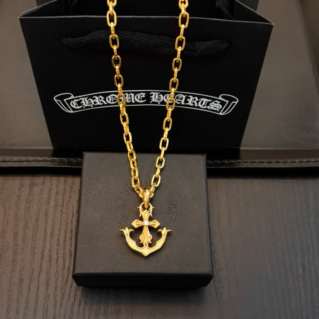 Gold-tone anchor pendant necklace with curb-link chain