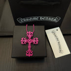 Pink beaded cross necklace with floral cross pendant in a jewelry box with tag