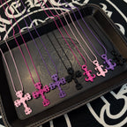 Ornate cross necklace with pink and purple bead chains and floral cross pendants