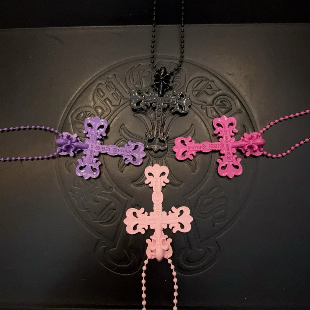 Multi-cross necklace with bead chains in purple, pink, and black tones