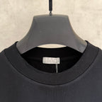 Black Dior short-sleeve T-shirt neckline label and ribbed crew collar.