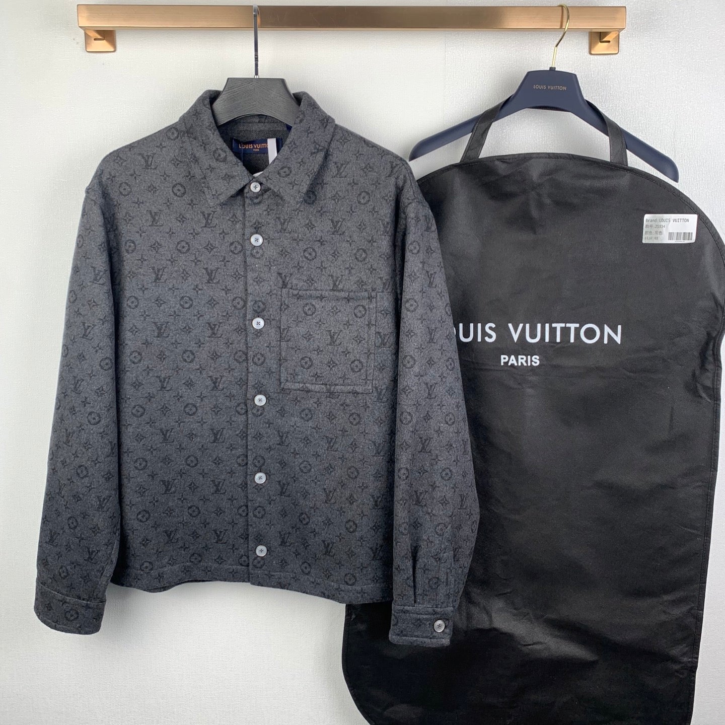 Monogram button-up shirt with chest pocket, dark gray fabric, and white snap buttons