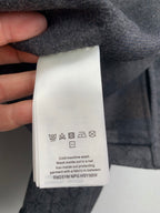 Inside care label on grey Louis Vuitton long-sleeve jacket