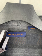 Louis Vuitton logo label and size tag on grey long-sleeve jacket