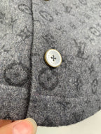 Monogram button-up shirt close-up of gold-trimmed snap button on pocket area