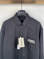 Long-sleeve button-up shirt, dark gray, chest pocket with logo patch