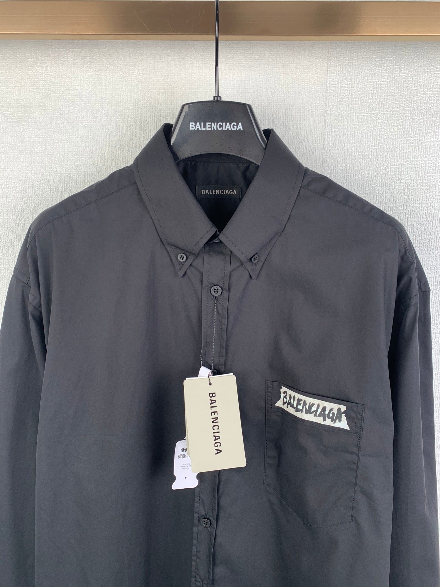 Long-sleeve button-up shirt, dark gray, chest pocket with logo patch