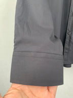Long-sleeve button-up shirt, gray, straight hem with visible stitching detail