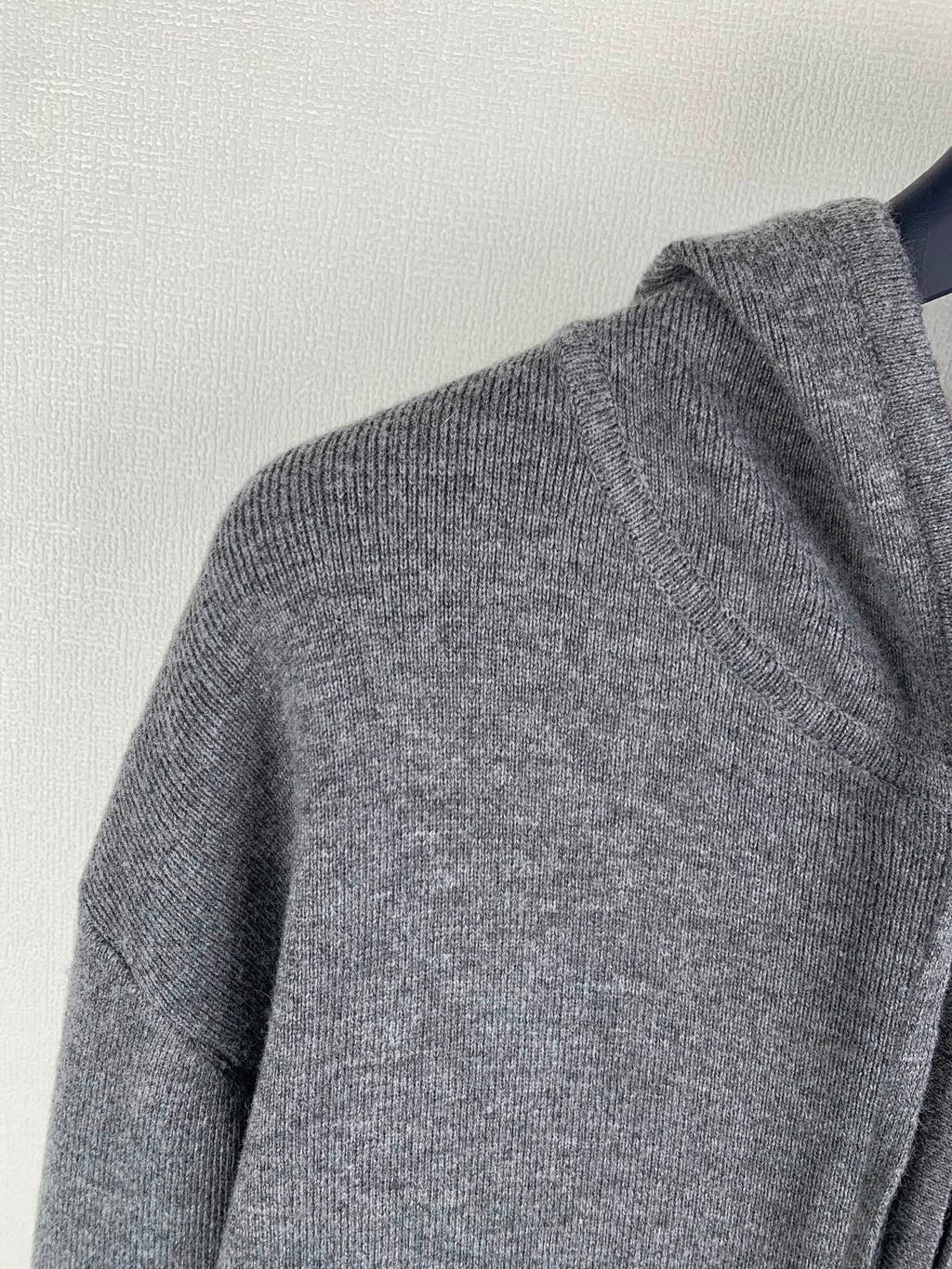 Gray knit hoodie back shoulder panel with ribbed trim
