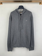 Gray zip-up hoodie with drawstring hood and front zipper