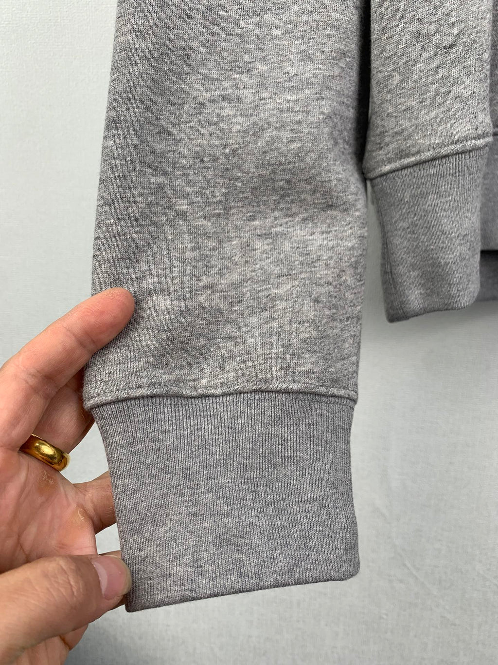 Gray hoodie hem and sleeve cuff, ribbed knit fabric with stitching