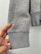 Gray hoodie hem and sleeve cuff, ribbed knit fabric with stitching
