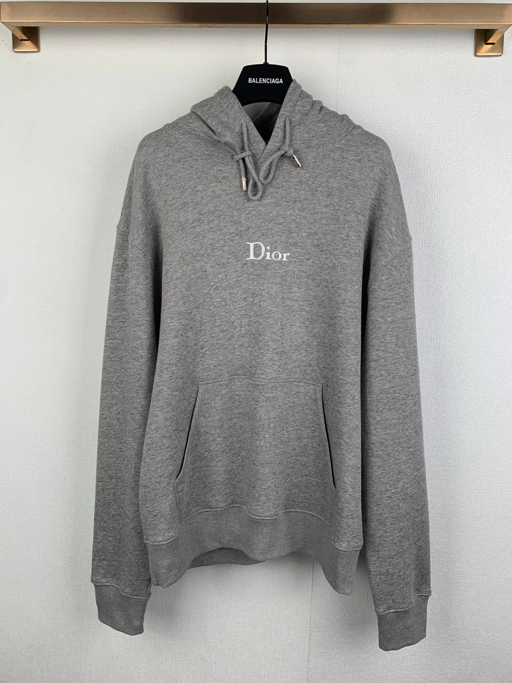 Gray long-sleeve hoodie with front pouch pocket, drawstring hood, Dior logo