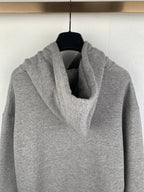 Gray pullover hoodie close-up of cowl hood and front pouch pocket