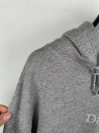 Gray hoodie hood and sleeve with drawstring cord detail