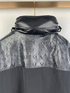 Long coat with monogram print hood and high collar, dark outer with gray logo pattern