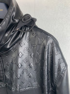 Louis Vuitton jacket sleeve with embossed monogram pattern and stitched detail