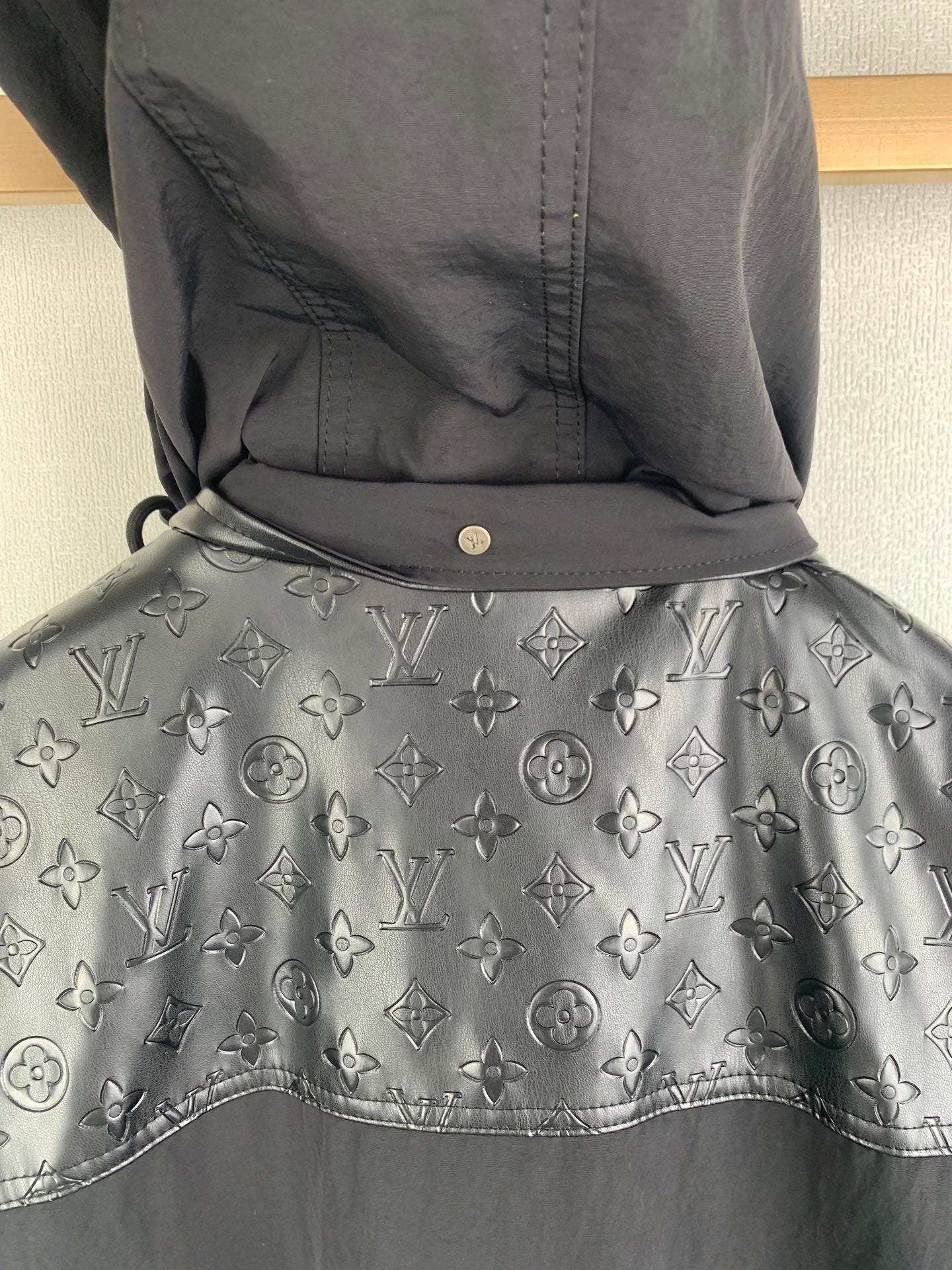 Long coat with monogram print hood and drawstring, dark fabric with gray logo pattern