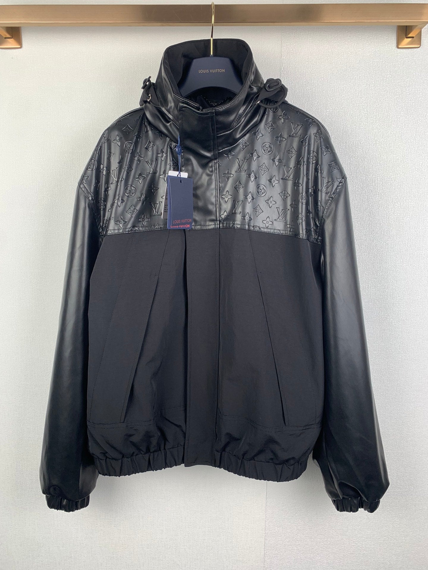 Louis Vuitton long hooded jacket with monogram print panels and elastic hem