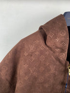 Dark brown monogram hooded jacket with raised collar and zipper pull detail