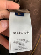 Long garment care label with size 50 and washing symbols