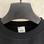 Black T-shirt neckline with Burberry logo label