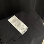 Black T-shirt with internal size and care label at sleeve