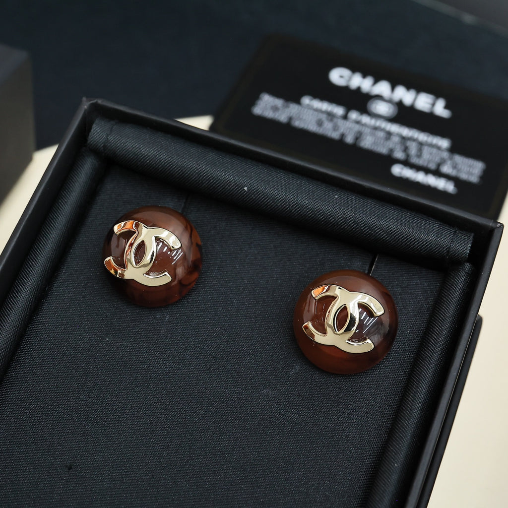 Brown round stud earrings with gold-tone Chanel CC logo, pair in black gift box