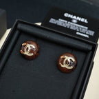 Brown round stud earrings with gold-tone Chanel CC logo, pair in black gift box