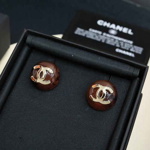 Brown round stud earrings with gold-tone Chanel CC logo, pair in black gift box