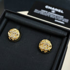 Gold-tone logo stud earrings with circular setting and clear rhinestone accents
