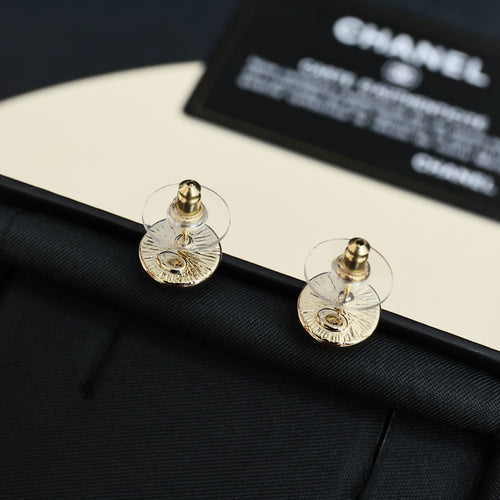 Chanel stud earrings: round pink enamel with gold-tone CC logo, screw-back