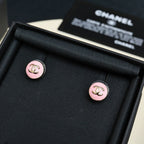 Chanel stud earrings with round pink enamel and gold-tone CC logo on black box