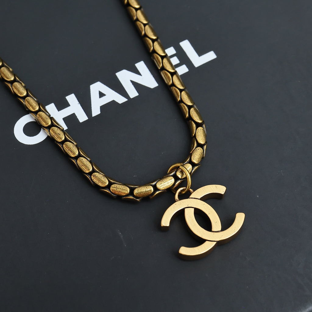 Gold-tone chain necklace with Chanel logo pendant charm