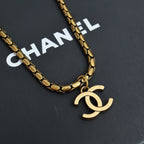 Gold-tone chain necklace with Chanel logo pendant charm