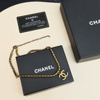 Gold-tone Chanel logo chain necklace on gift box