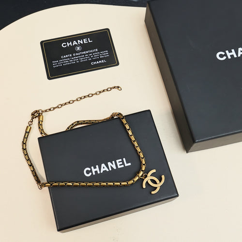 Gold-tone Chanel logo chain necklace on gift box