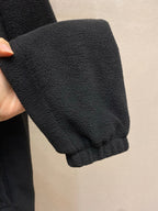Prada jacket sleeve cuff in dark textured fleece, close-up