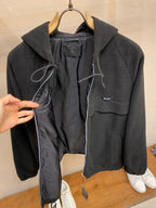 Prada hooded zip jacket open front showing black lining and drawcord details, dark color