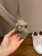 Beige sweatpants cuff with gathered fabric at the hem