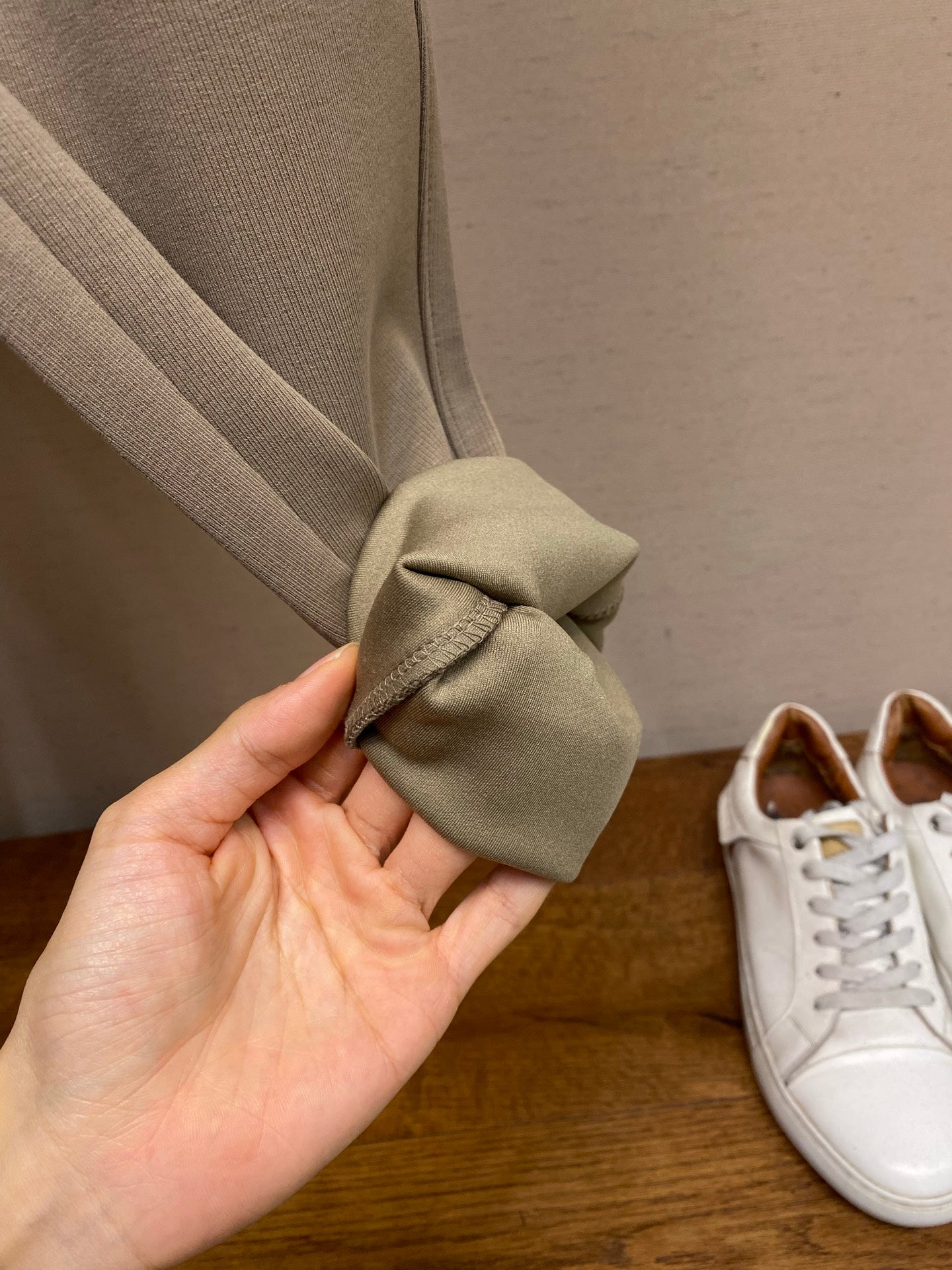 Beige sweatpants cuff with gathered fabric at the hem