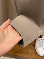Beige sweatpants hem with stitched edge and elastic cuff