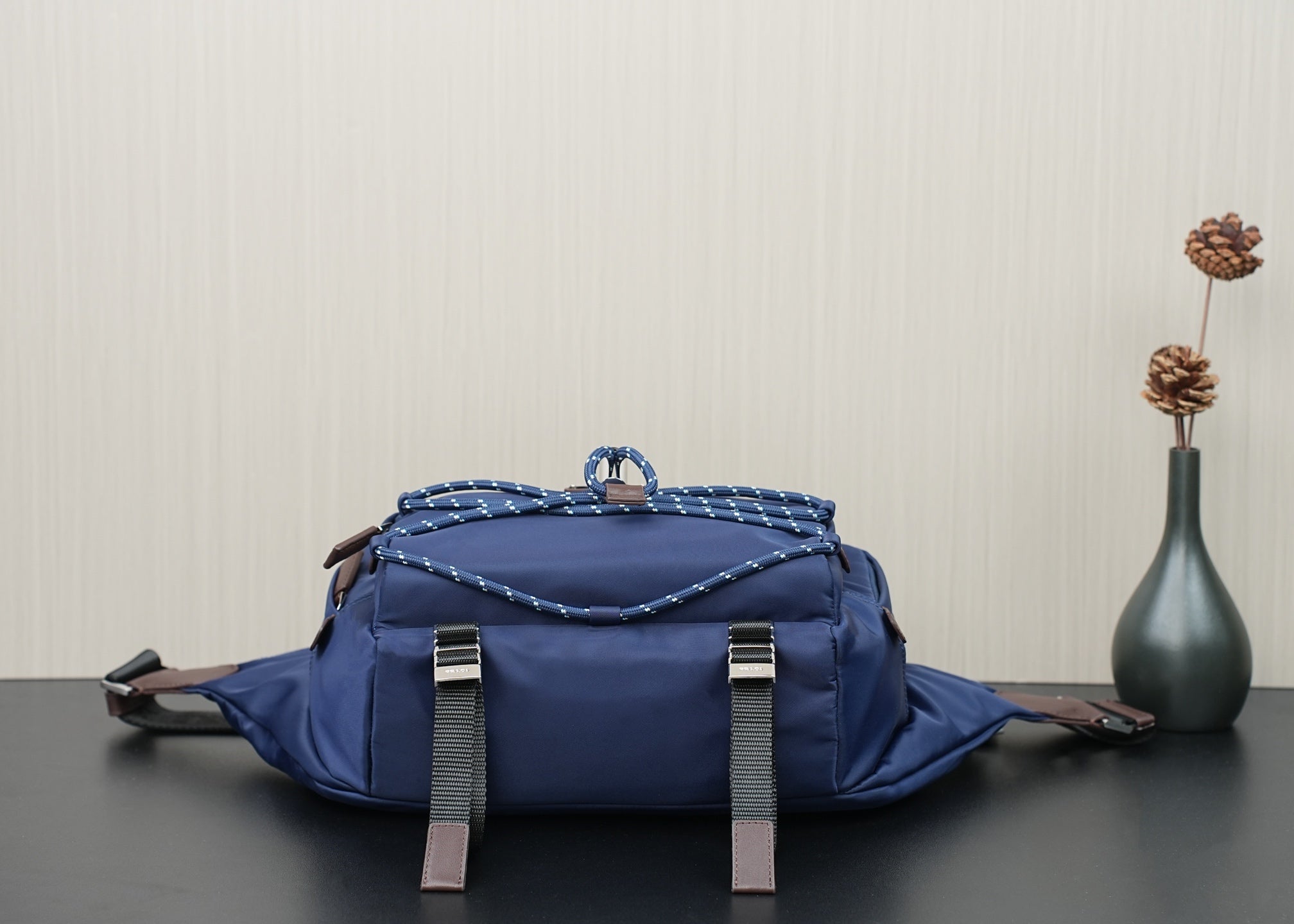Prada dark-blue nylon bag with front straps and top handle