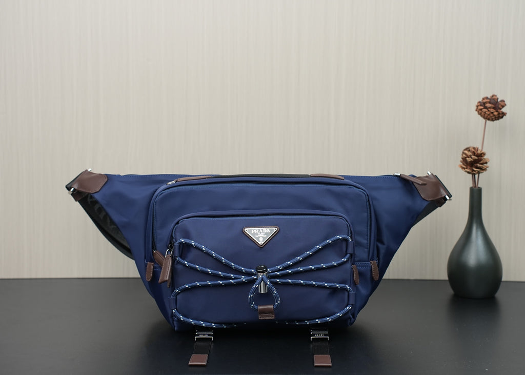 Prada dark-blue nylon crossbody bag with top zip and front patch pocket
