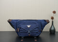 Prada dark-blue nylon crossbody bag with top zip and front patch pocket