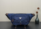 Prada dark-blue nylon crossbody bag with top zip and front patch pocket
