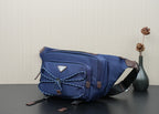 Prada dark-blue crossbody bag with adjustable shoulder strap and front logo triangle