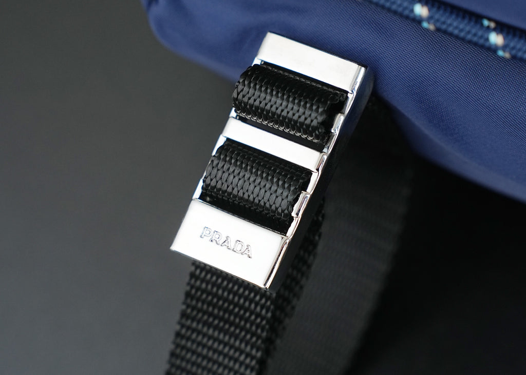 Prada logo metal buckle on dark-blue nylon strap